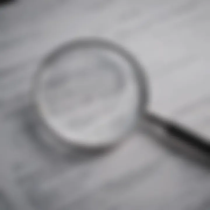 Close-up of a magnifying glass over insurance documents